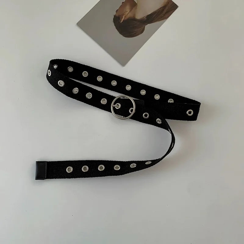 Perforated black canvas belt