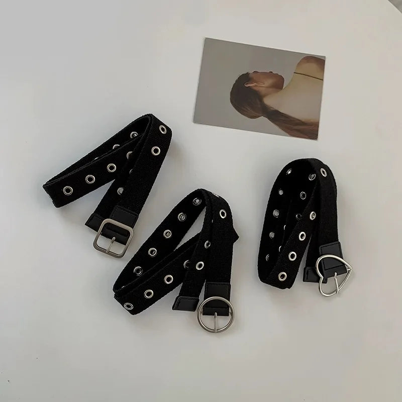 Perforated black canvas belt