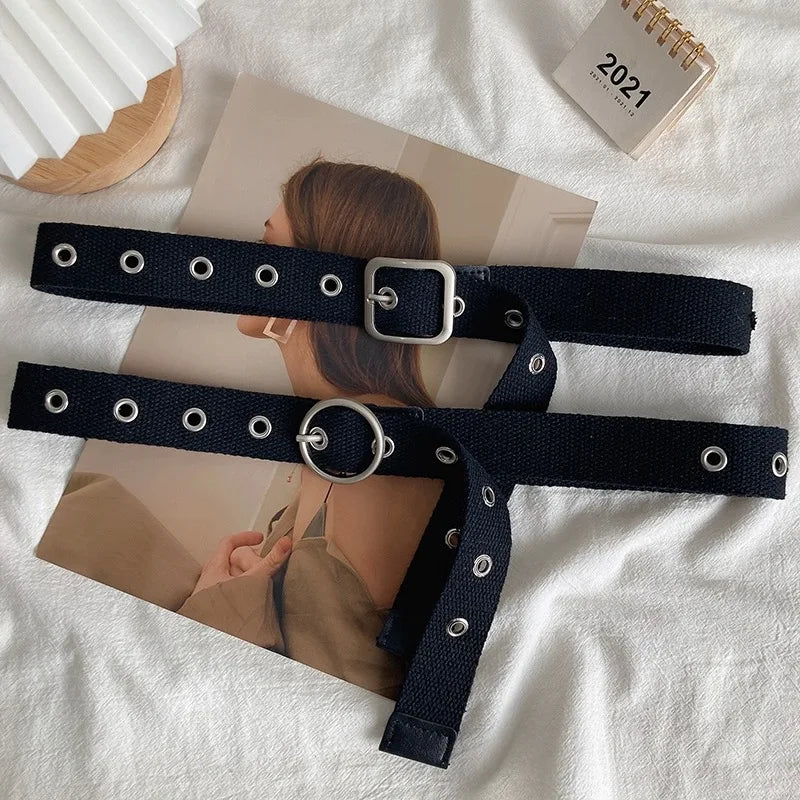 Perforated black canvas belt